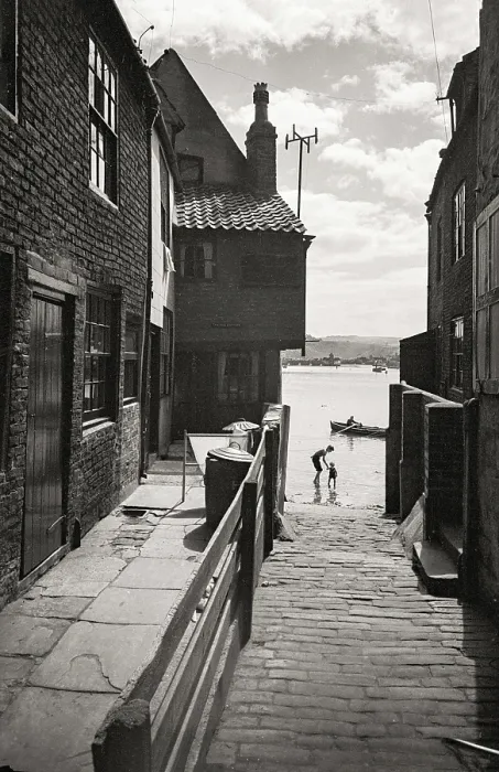 Framed Print : Adult and child silhouette in water in Yorkshire coastal fishing village Date: 1947 - 1948 Framed Print : Adult and child silhouette in water in Yorkshire coastal fishing village Date: 1947 - 1948
