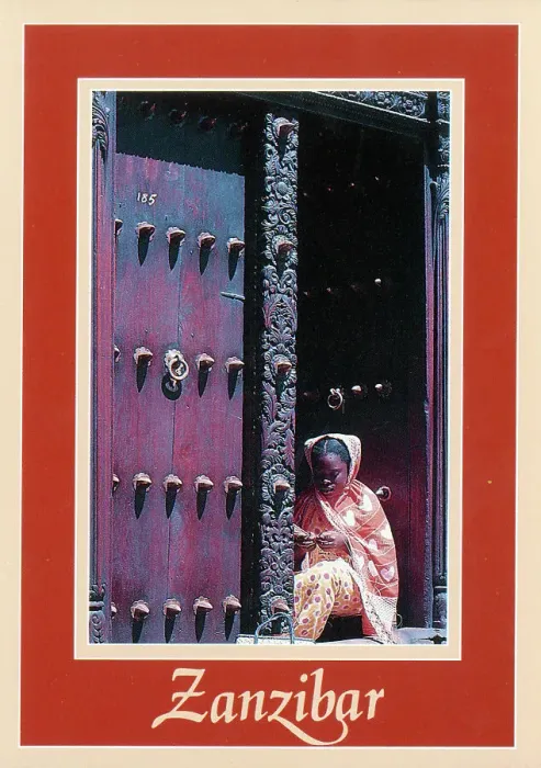 Framed Print : Africa - Zanzibar - Girl in ornately-carved wooden doorway