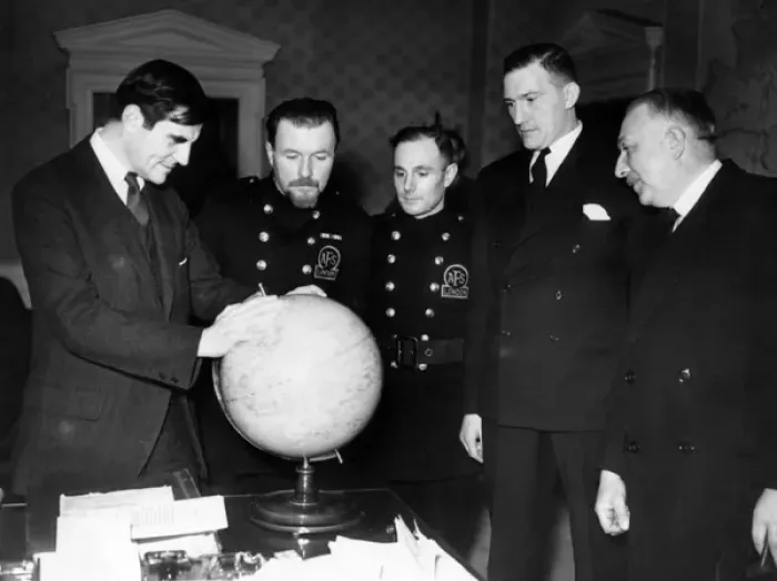 Framed Print : AFS men and others looking at a globe, WW2 Framed Print : AFS men and others looking at a globe, WW2