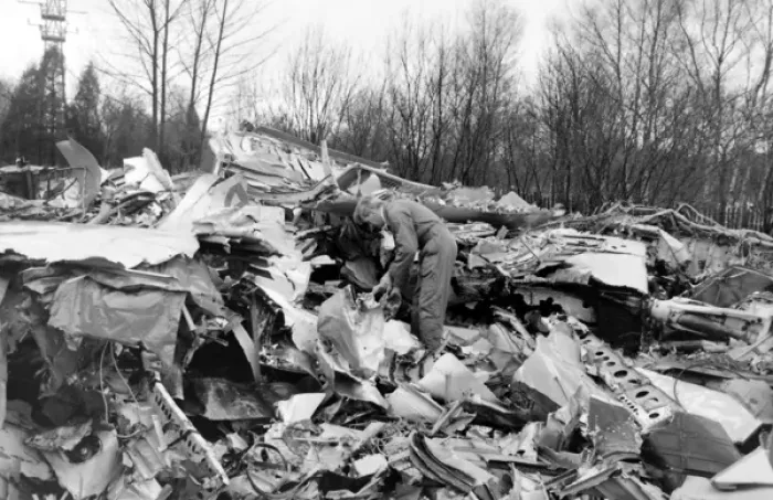 Framed Print : Air crash investigator examining debris Framed Print : Air crash investigator examining debris