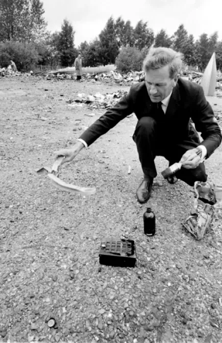 Framed Print : Air crash investigator examining debris Framed Print : Air crash investigator examining debris