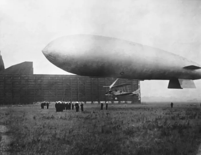 Framed Print : Airship with Biplane Fighter Aircraft Hanging Underneath Framed Print : Airship with Biplane Fighter Aircraft Hanging Underneath