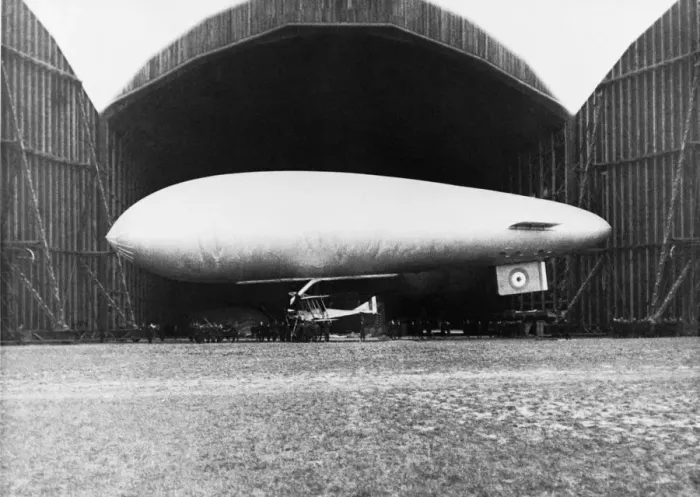 Framed Print : Airship with Biplane Fighter Aircraft Hanging Underneath Framed Print : Airship with Biplane Fighter Aircraft Hanging Underneath