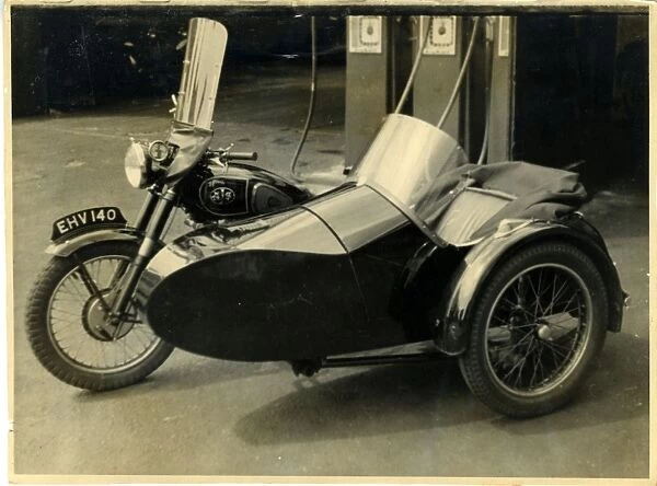 AJS  /  A J Stevens British Motorcycle & Sidecar at a Garage, En