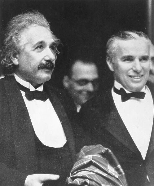 Albert Einstein with Charlie Chaplin at movie premiere