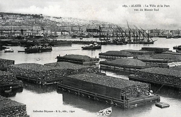 Algiers, Algeria - Quarried stone on floating barges in the harbour, awaiting export