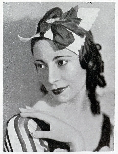 Alicia Markova, ballet dancer, theatrical portrait. Captioned, A good shot'of Markova'. With description, Markova, who has returned to the Old Vic-Wells Ballet, where she danced in the 'Lac des Cygnes'