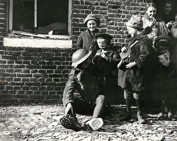 American soldier with children, Brancourt, France, WW1