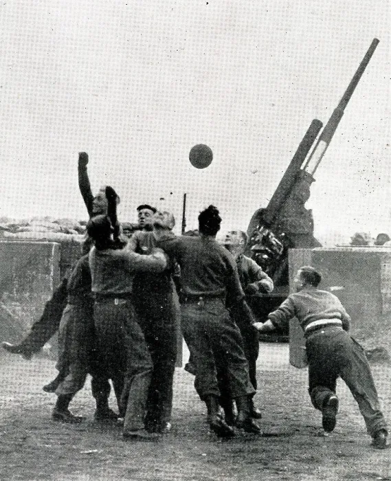 Framed Print : Anti-Aircraft crew members play football, WW2 Framed Print : Anti-Aircraft crew members play football, WW2