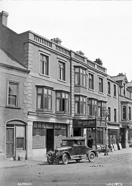 Antrim - a photograph of the Antrim arms hotel with a motor car outside