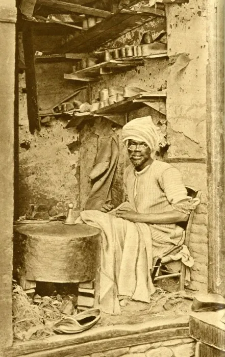 Framed Print : Arab cobbler at work in his shop, Cairo, Egypt Framed Print : Arab cobbler at work in his shop, Cairo, Egypt