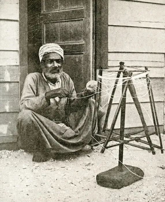 Framed Print : Arab fisherman winding twine for nets, Port Said, Egypt Framed Print : Arab fisherman winding twine for nets, Port Said, Egypt
