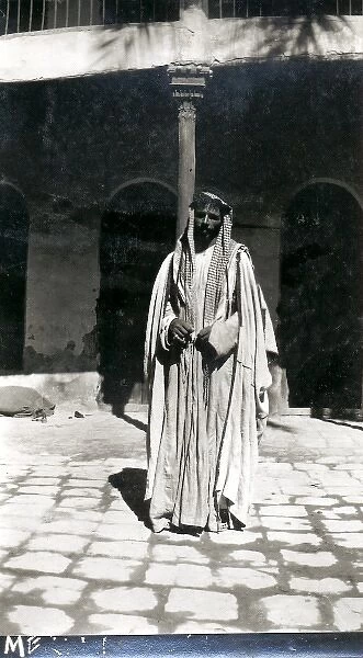 Arab man in a courtyard, Middle East