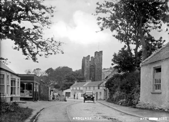 Framed Print : Ardglass - a view of the town looking up to the Castle with a motor car on the road Framed Print : Ardglass - a view of the town looking up to the Castle with a motor car on the road