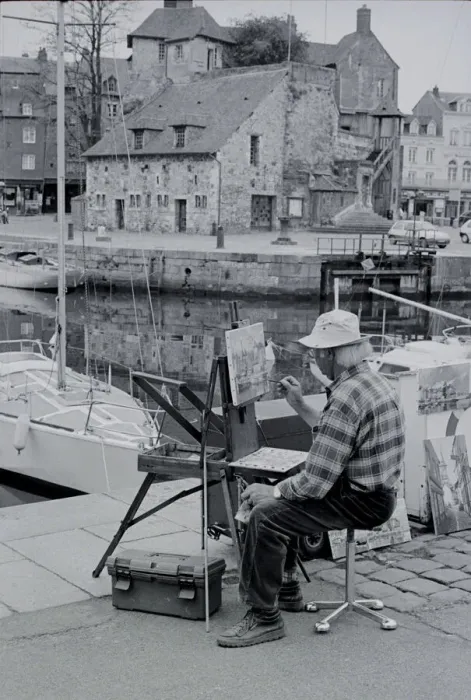 Framed Print : Artist. Seated artist painting a harbour scene at Honfleur Normandie France Date Framed Print : Artist. Seated artist painting a harbour scene at Honfleur Normandie France Date
