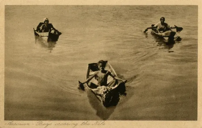 Framed Print : Aswan, Egypt - Three boys crossing the Nile in small boats Framed Print : Aswan, Egypt - Three boys crossing the Nile in small boats