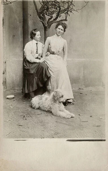 Austrian Mother and Daughter with their shaggy pet dog