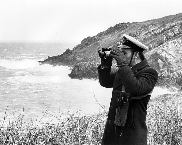 Auxiliary coastguard with binoculars, West Country