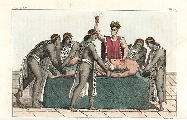 An Aztec priest removes a mans heart in a human sacrifice