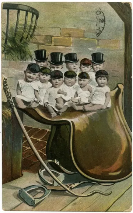 Framed Print : Babies in hats, sitting on a large saddle Framed Print : Babies in hats, sitting on a large saddle
