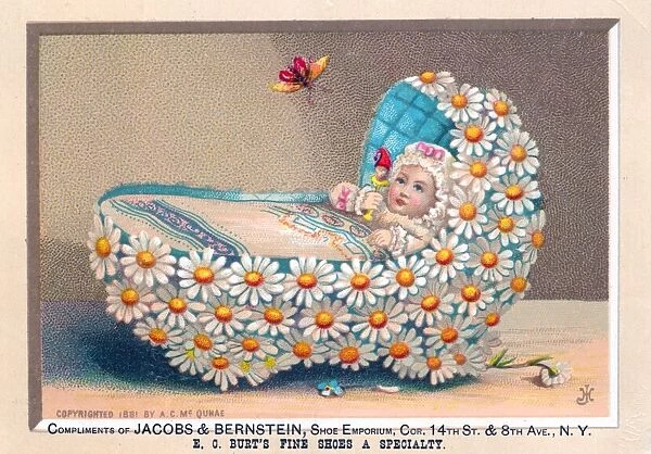 Baby in cradle made of flowers on a greetings card