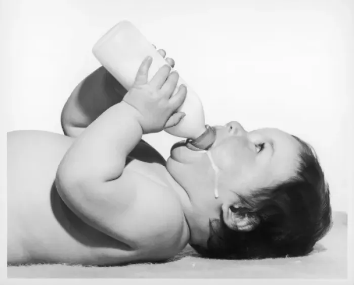 Framed Print : A Baby having a Drink Framed Print : A Baby having a Drink