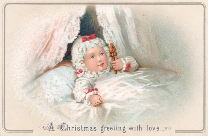 Framed Print : Baby with rattle in a cot on a Christmas card Framed Print : Baby with rattle in a cot on a Christmas card