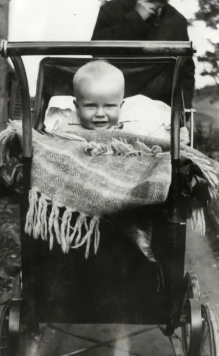 Framed Print : A Baby smiling out from a large Perambulator Framed Print : A Baby smiling out from a large Perambulator