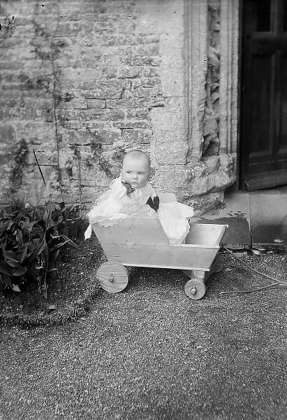 Baby in Wooden Cart