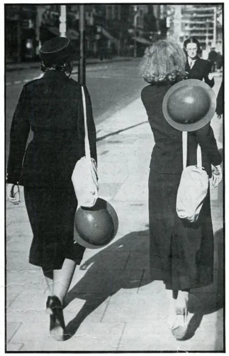 Framed Print : Backs of two walking girls holding helmets, September 1939 Framed Print : Backs of two walking girls holding helmets, September 1939