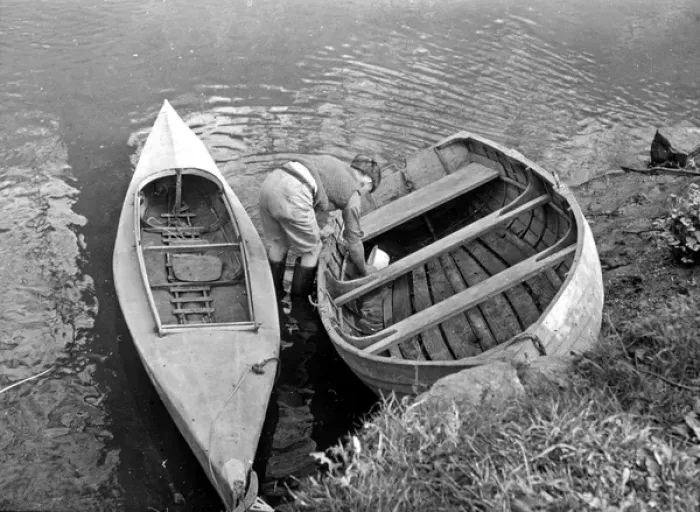 Framed Print : Bailing out water from a boat Framed Print : Bailing out water from a boat