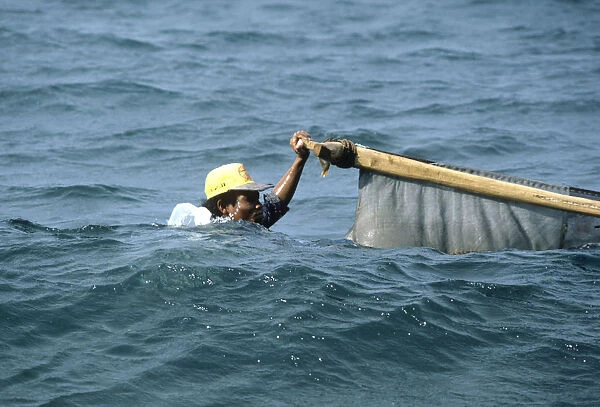 Bali fisherman up to his neck in water