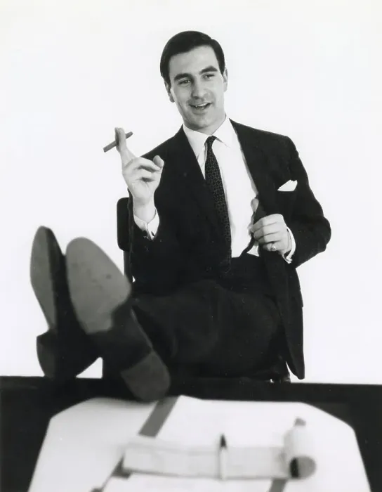 Framed Print : A banker puts his feet up on his desk and smokes a cigar. Date: late 1960s Framed Print : A banker puts his feet up on his desk and smokes a cigar. Date: late 1960s