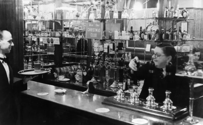 Framed Print : Barman and waiter working in a bar Framed Print : Barman and waiter working in a bar