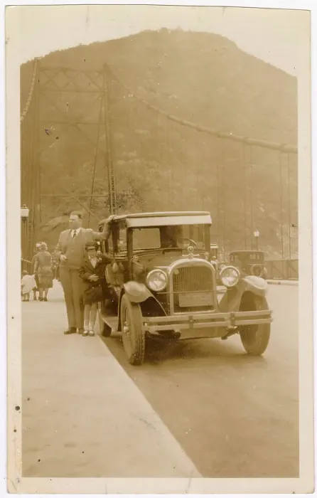 Framed Print : Bear Mountain Bridge on the Hudson River, New York State, USA - man and girl with a Hudson Essex 6 cylinder car (circa 1926). Date: 1927 Framed Print : Bear Mountain Bridge on the Hudson River, New York State, USA - man and girl with a Hudson Essex 6 cylinder car (circa 1926). Date: 1927