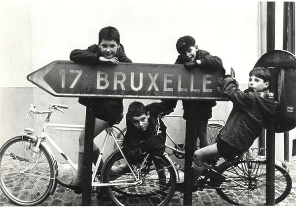 Belgian boy scouts with road sign