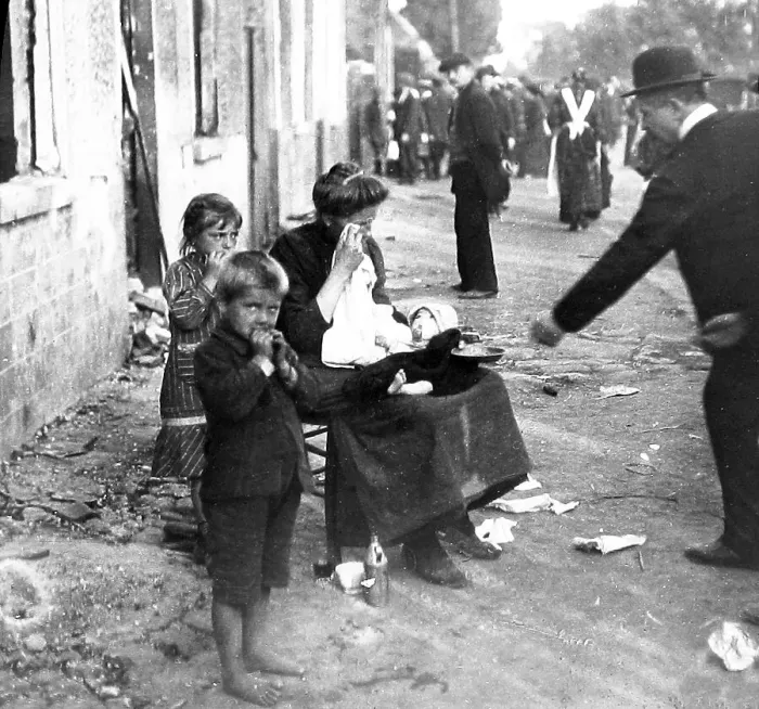 Framed Print : Belgian family begging in front of their burnt-out Framed Print : Belgian family begging in front of their burnt-out
