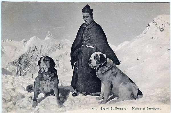 A Benedictine monk with two St Bernard rescue dogs
