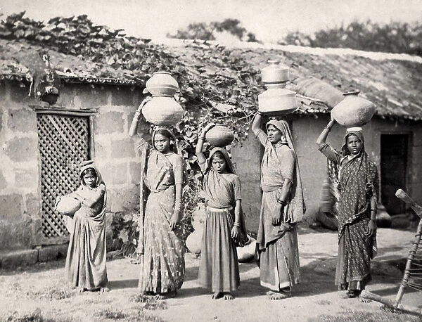 Bheel of Bhil women carrying water Kathiawar, India
