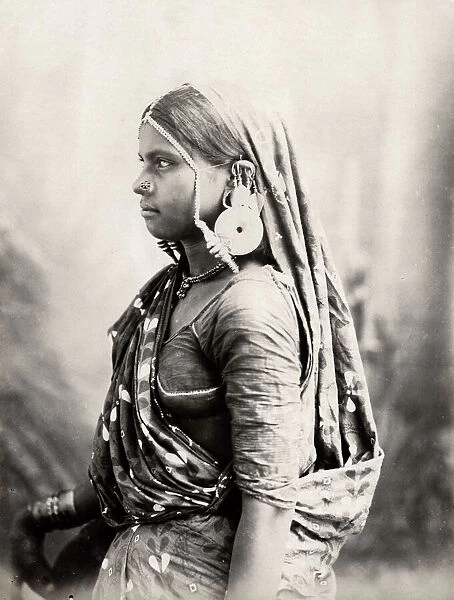 A Bheel woman in gala costume, India