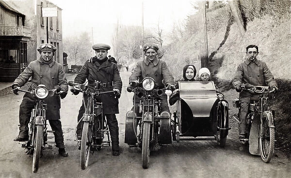 Four bikers & children on motorcycles, including Royal Enfie