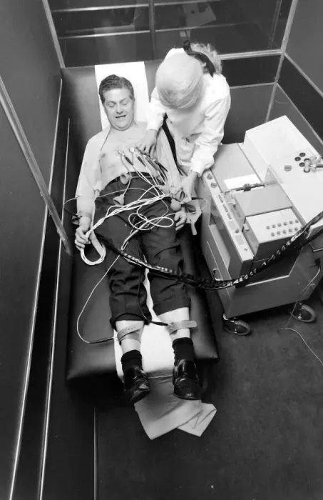 Framed Print : Biomedical centre, London -- a woman attaches sensors to a patient. Date: 1972 Framed Print : Biomedical centre, London -- a woman attaches sensors to a patient. Date: 1972
