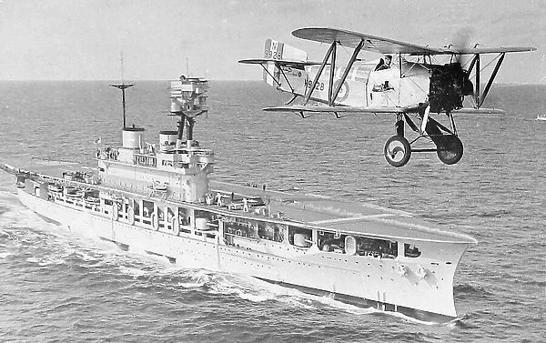 Biplane just taken off from an aircraft carrier early 1900s