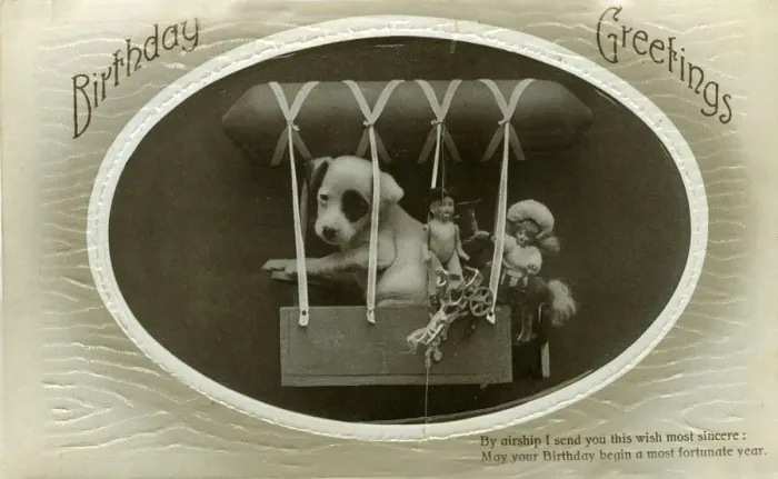 Framed Print : Birthday postcard, puppy and toys in an airship Framed Print : Birthday postcard, puppy and toys in an airship