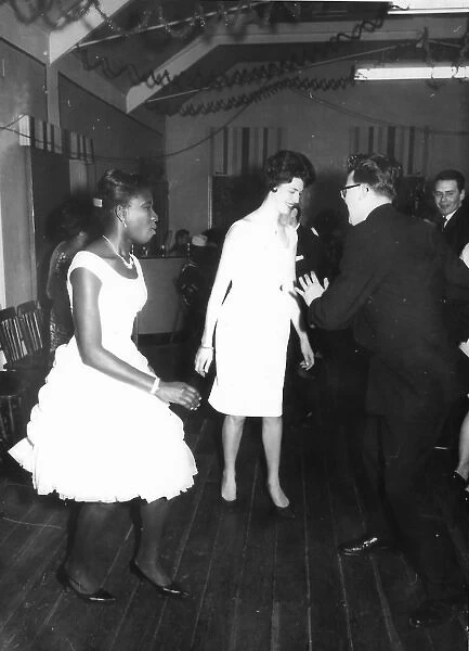 Black lady dancing in white peplum dress in Nottingham