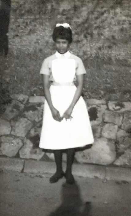 Framed Print : Black nurse standing by a wall in the grounds of Womans Hos Framed Print : Black nurse standing by a wall in the grounds of Womans Hos