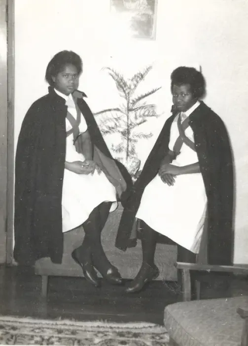 Framed Print : Two black student nurses sitting by a plant in the Womens H Framed Print : Two black student nurses sitting by a plant in the Womens H