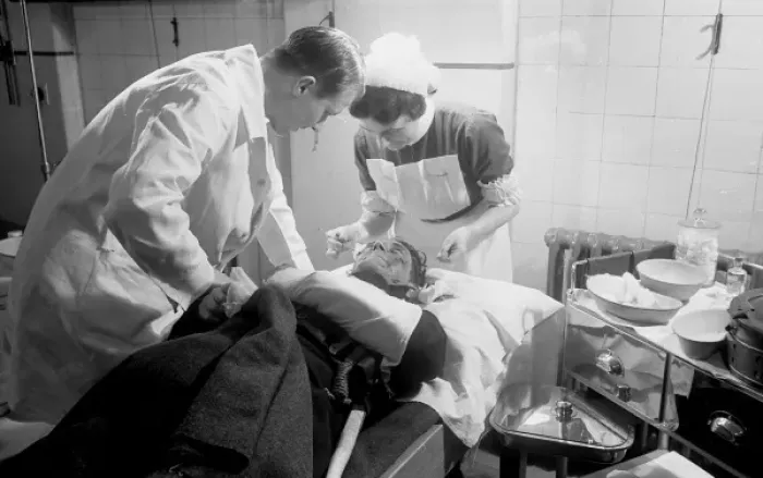 Framed Print : Blitz in London -- AFS personnel receiving treatment, WW2 Framed Print : Blitz in London -- AFS personnel receiving treatment, WW2