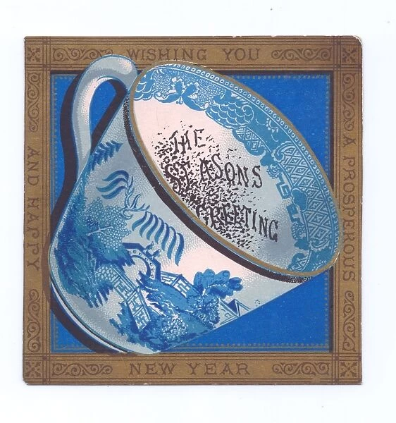 Blue and white china cup on a New Year postcard
