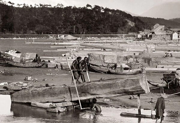 Boat builders in a shipyard, Hong Kong, c. 1900